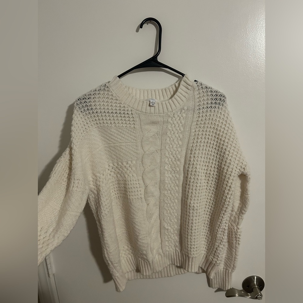 Size large. Oversized white sweater.